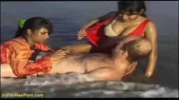 desi indian girls playing with a white tourist at the beach